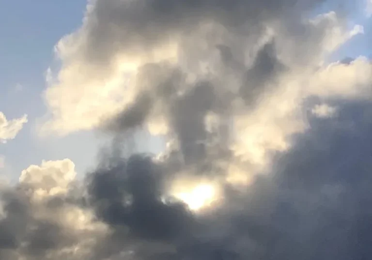 Dramatic clouds with sunlight breaking through.